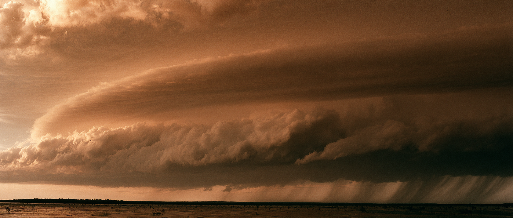A storm front over an open landscape.